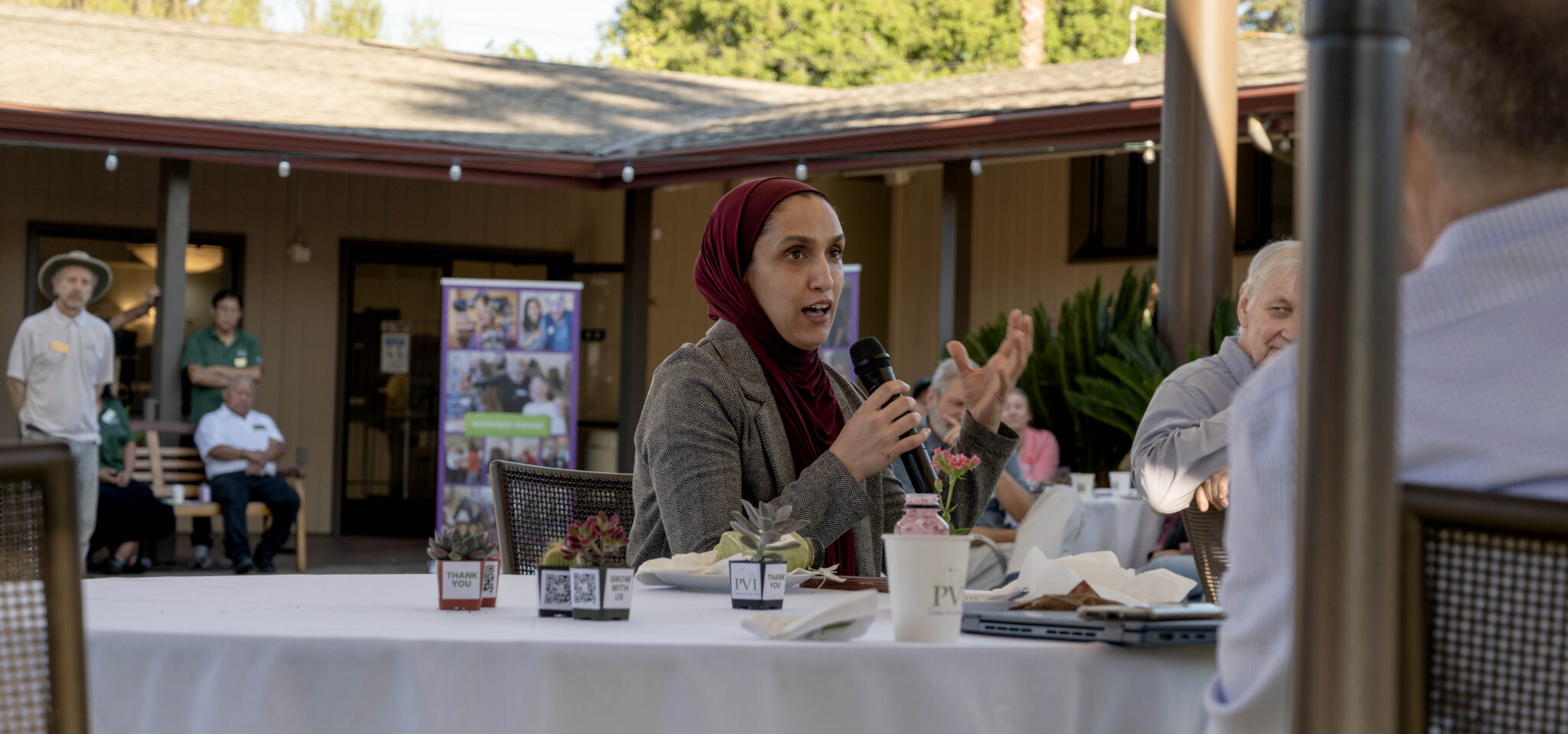 A nurse from Sequoia Healthcare District shares how beneficial PVI's Meals on Wheels service has been for her senior patients at PVI's  annual March for Meals Community Champions Breakfast at PVI’s Adult Activity Center at Little House in Menlo Park, Calif. on Thursday, March 19, 2026. Photo by Karina Patel.